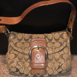 Tan and brown Coach pocketbook.